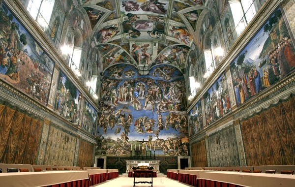 FILE - In this April 16, 2005 file photo, tables and chairs line the Sistine Chapel at the Vatican in preparation for the conclave. Five centuries after Michelangelo's ceiling frescoes were inaugurated at the Sistine Chapel, at least 10,000 people visit the site each day, raising concerns about temperature, dust and humidity affecting the famed art. But a Vatican Museums official said in the Vatican newspaper Wednesday, Oct. 31, 2012 that there are no plans to try to limit tourists' access. (AP Photo/Pier Paolo Cito, File)